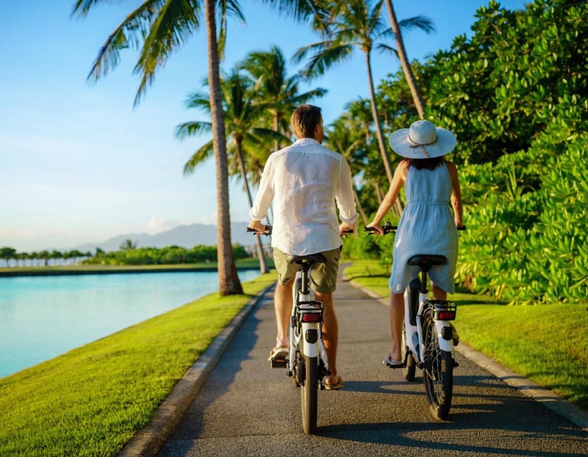 Couple riding electric bikes along a lagoon path in Laguna Phuket (illustration)