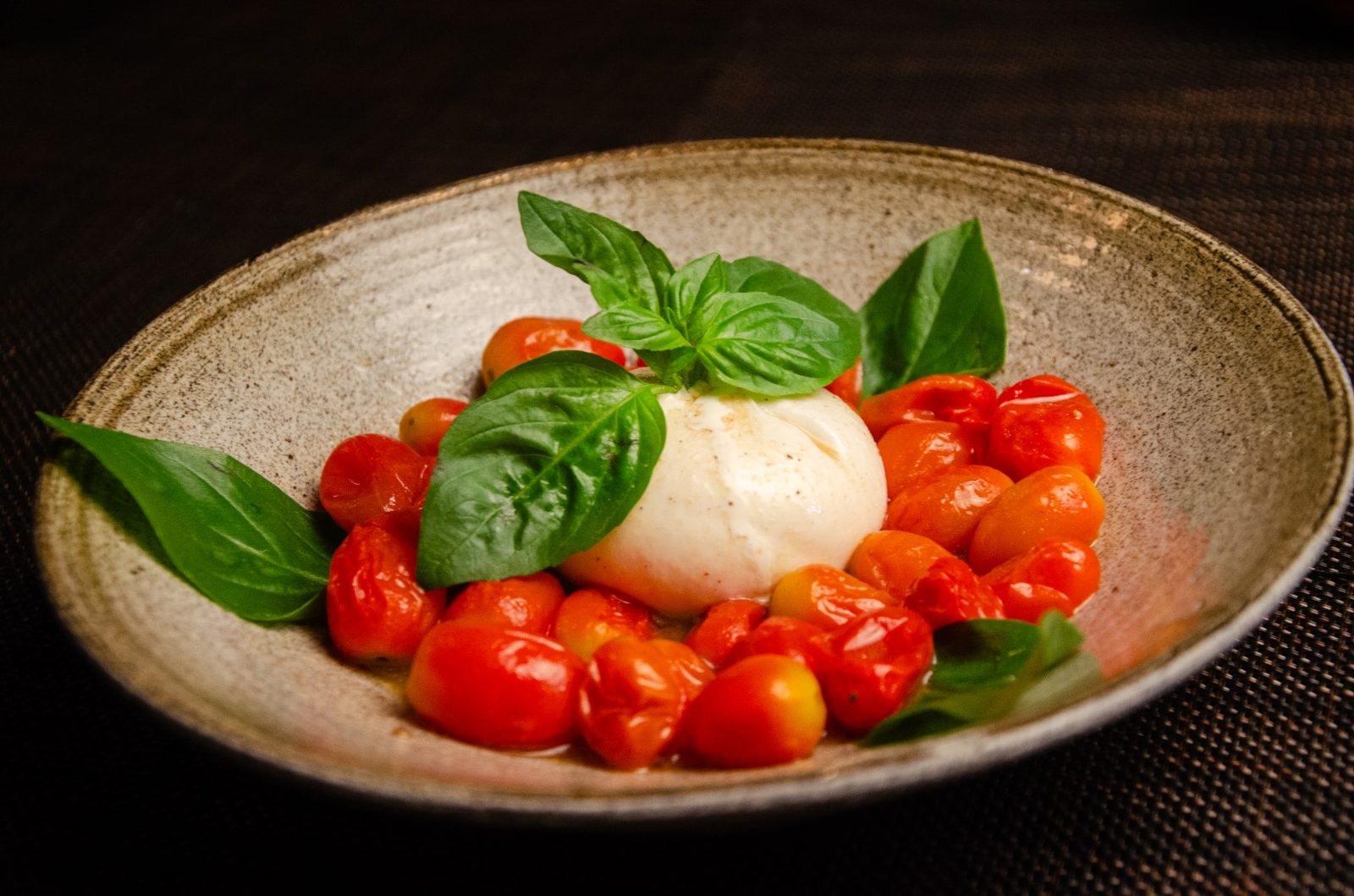Burrata with cherry tomatoes and basil at Pizza on Fire