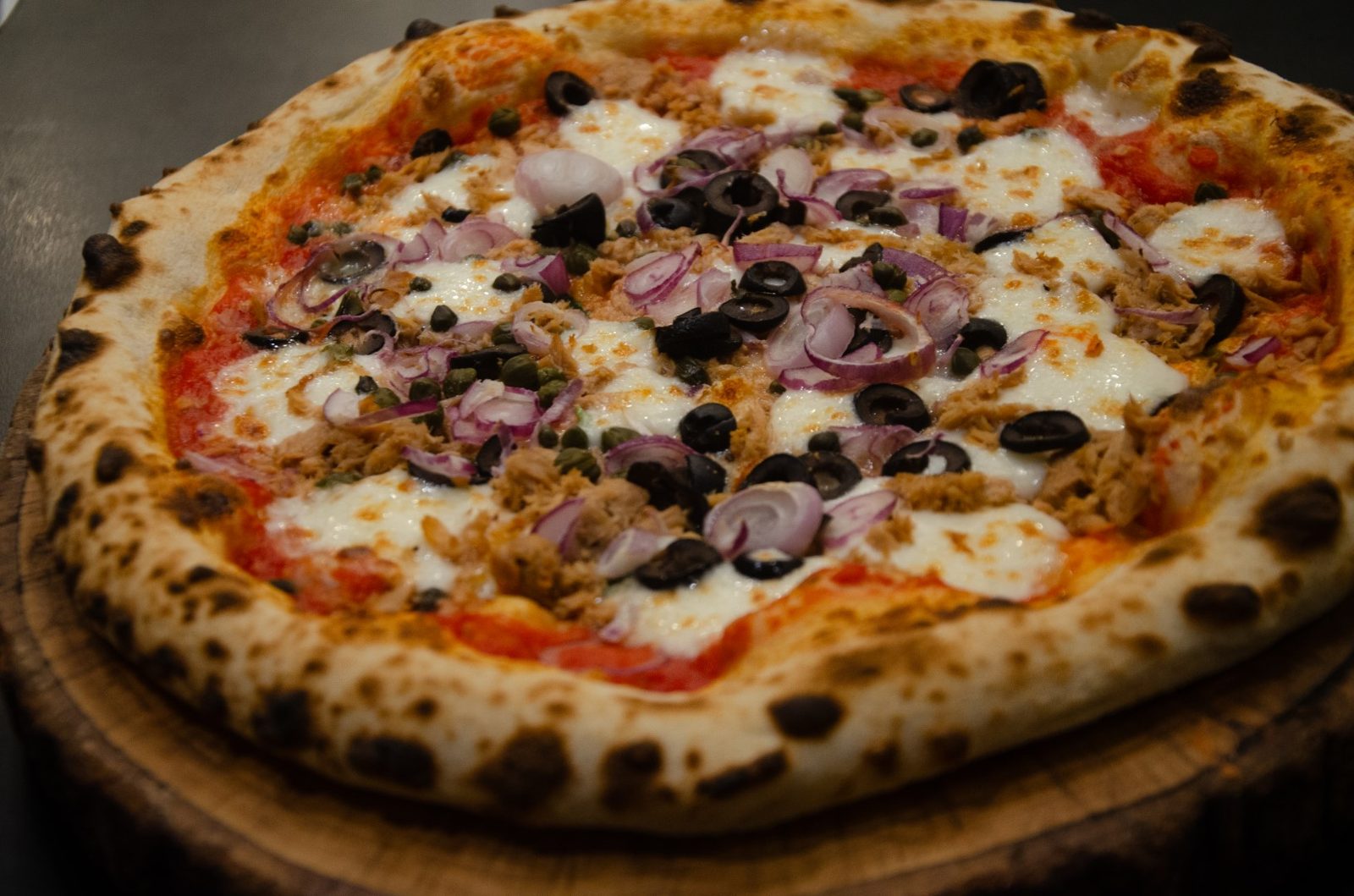 Pizza with olives and red onions at Pizza on Fire